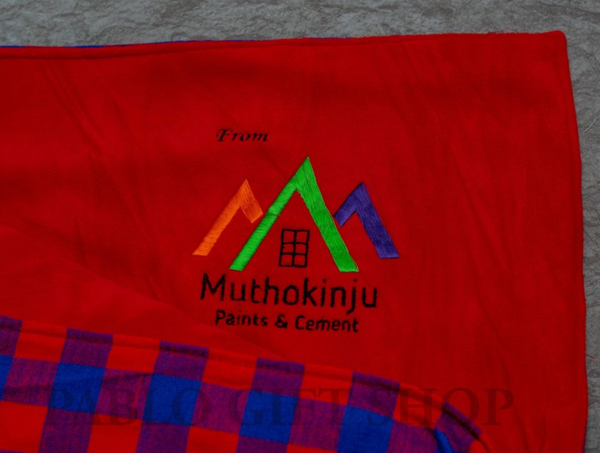 Maasai Light Fleece Blanket with a Mothokinju Logo